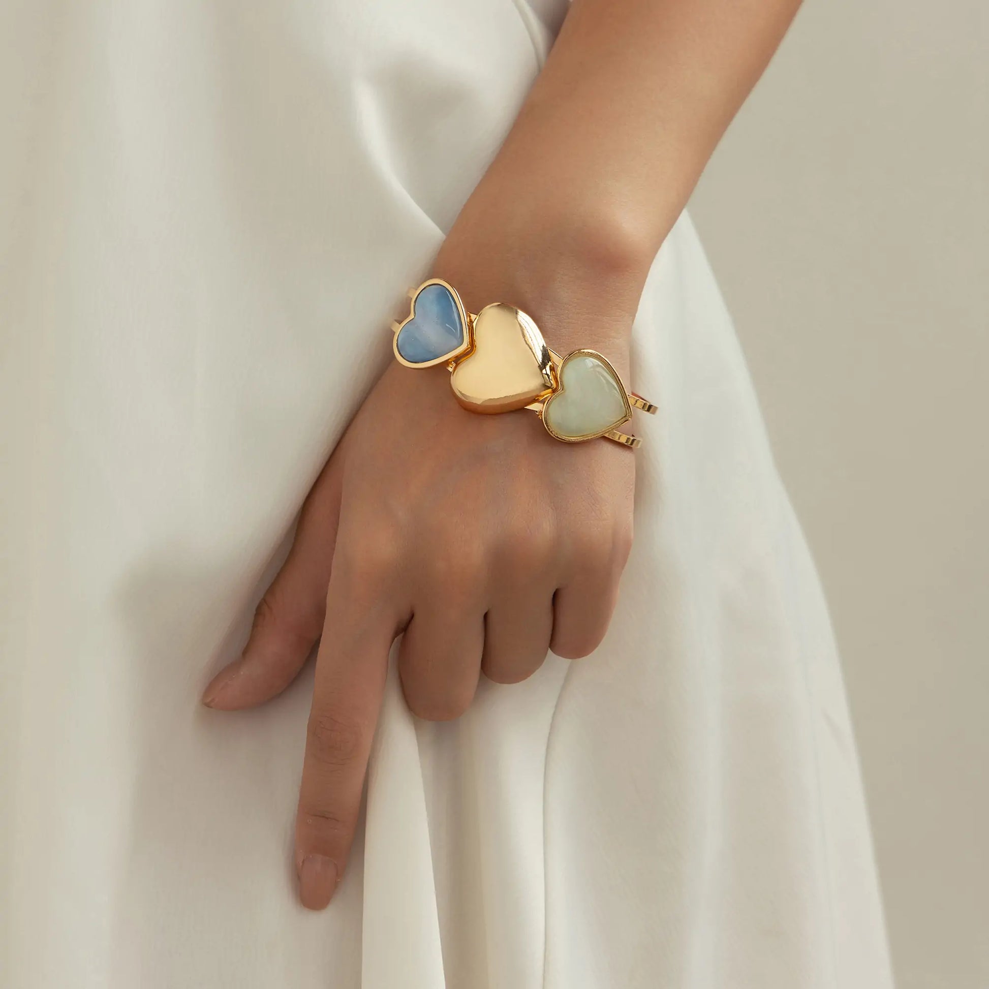 3-heart bangle bracelet acrylic bracelet worn by model – close wrist view