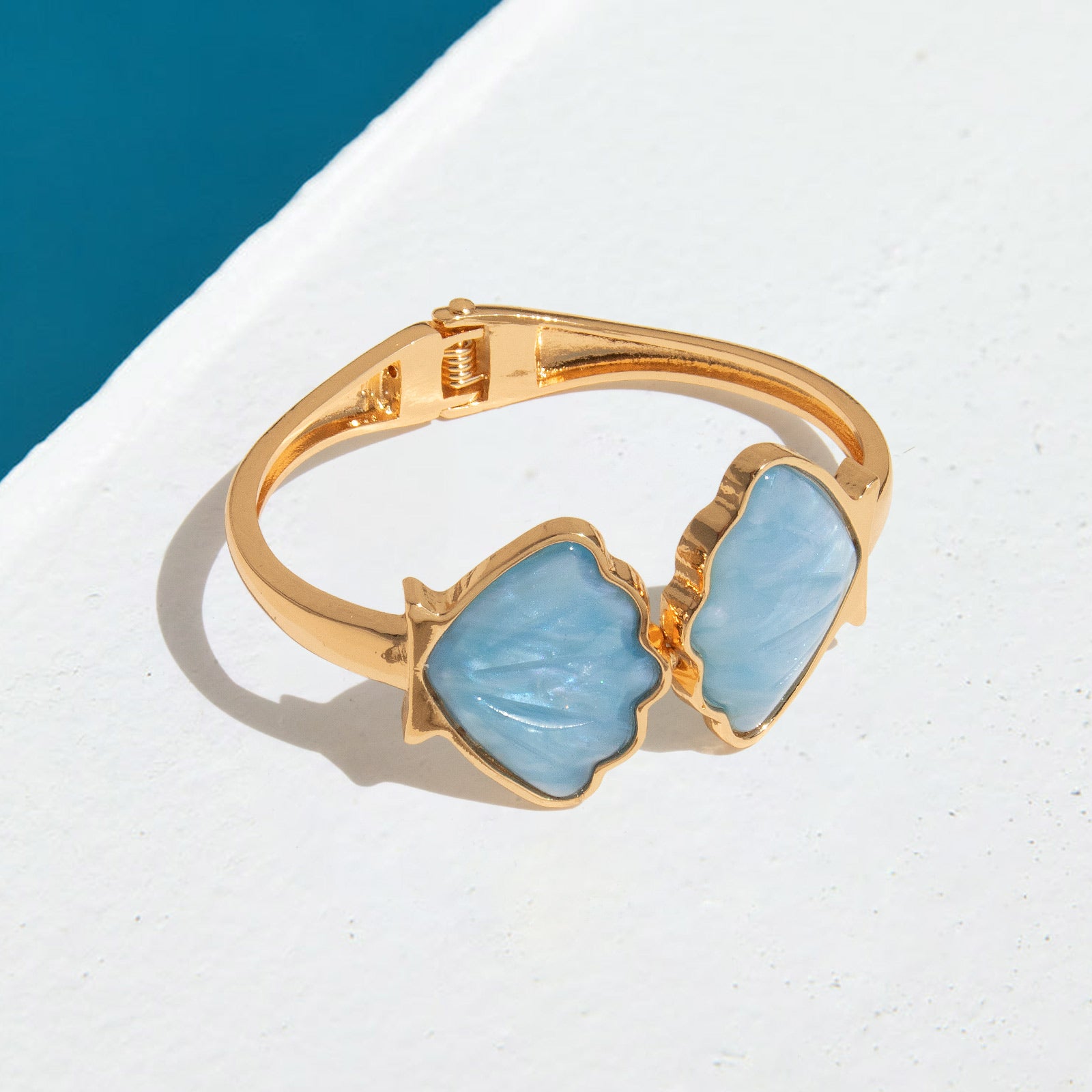 Side view of blue seashell bracelet with ocean-inspired design